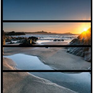 Wallario Möbelfolie Sonnenuntergang hinter einem Felsen am Strand