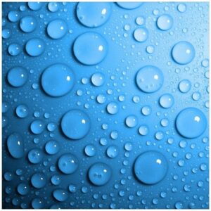 Wallario Möbelfolie Wassertropfen auf Blau
