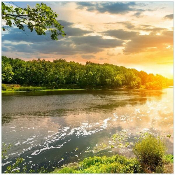 Wallario Möbelfolie Sonnenuntergang am Fluss in grüner Umgebung